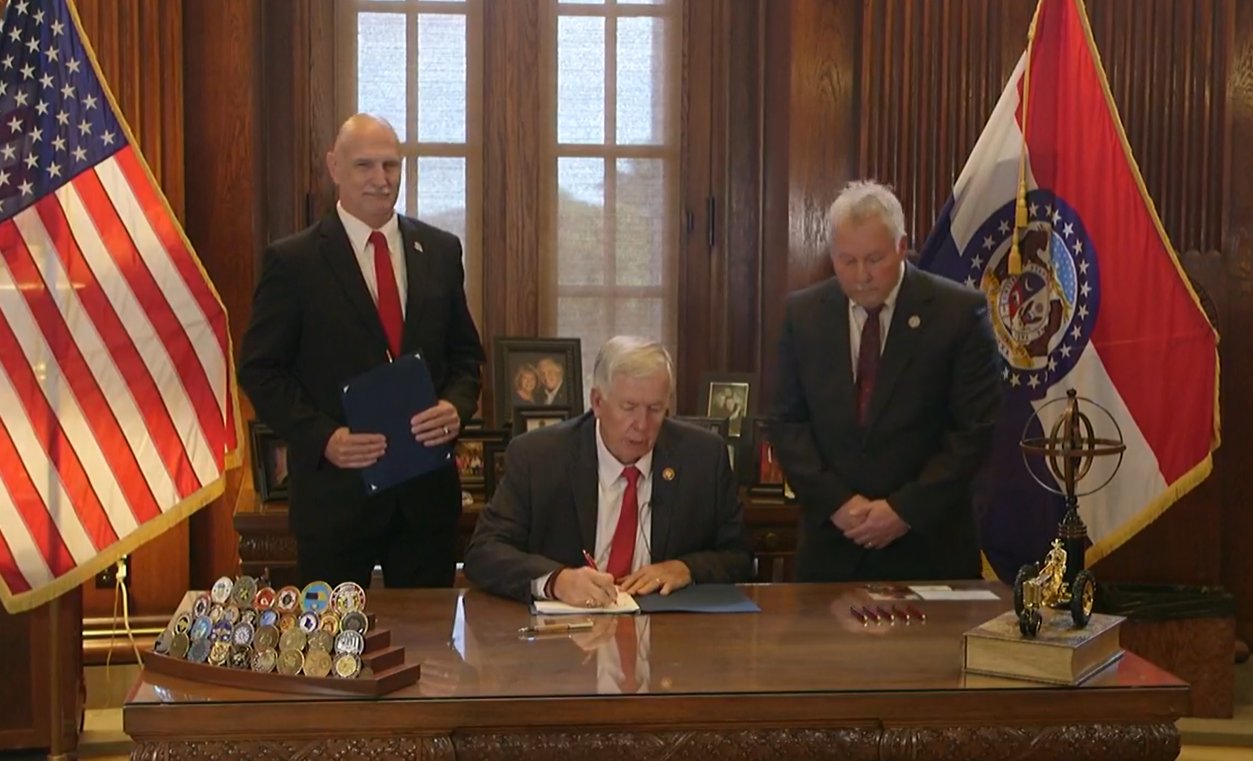 Gov. Mike Parson on Wednesday signs tax-cut legislation passed by legislators in the special session.